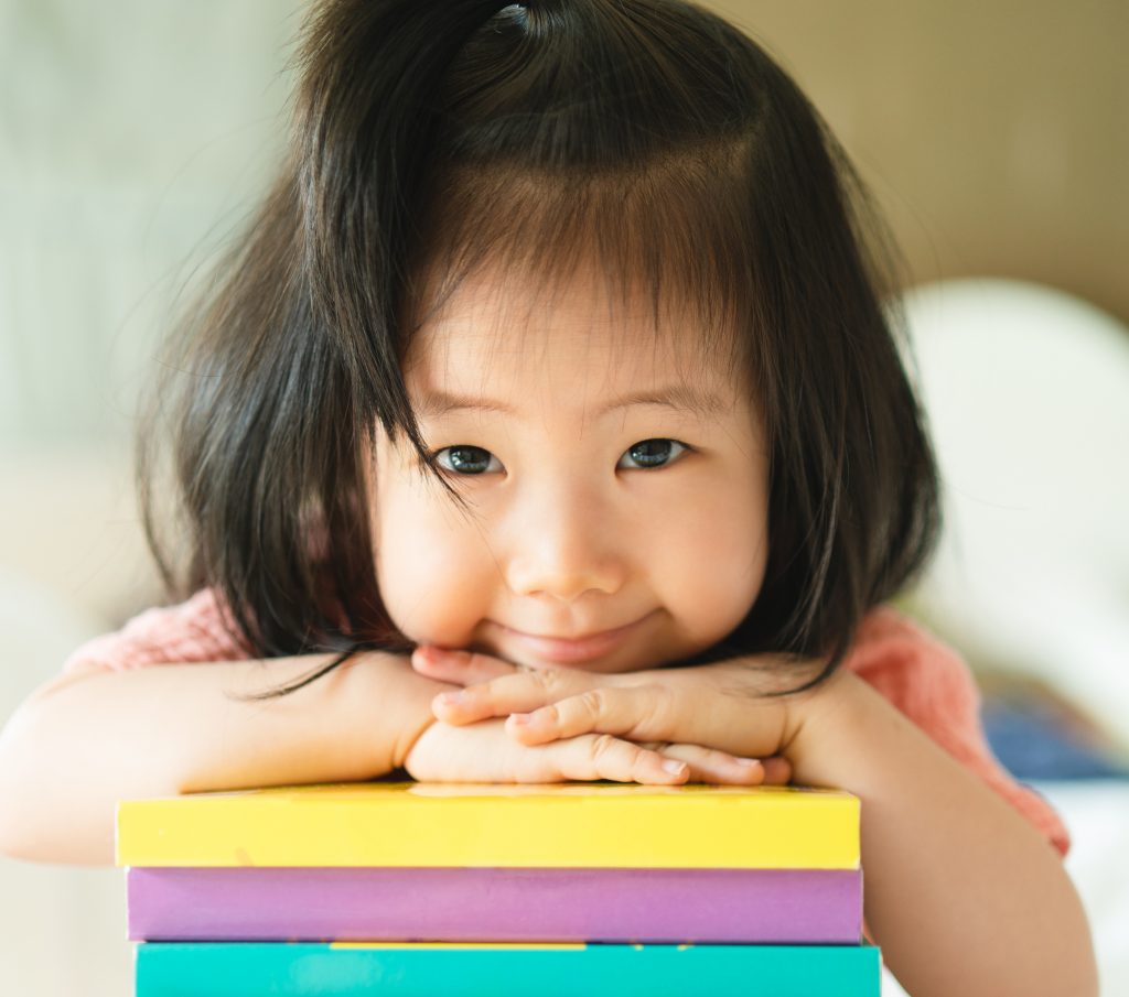 Panoramic Of Asian Toddler Portrait Put Her Chin And Smiling Ove